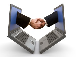 Hand Shake Between Laptops